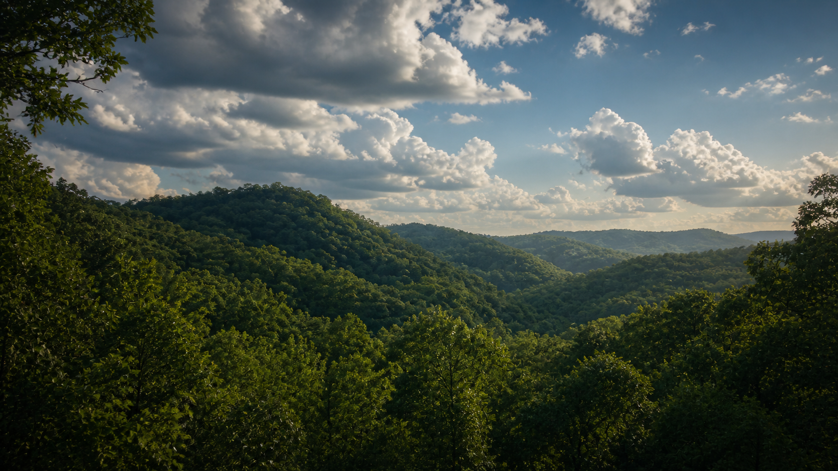Green Appalachian hills beneath a wide evening sky